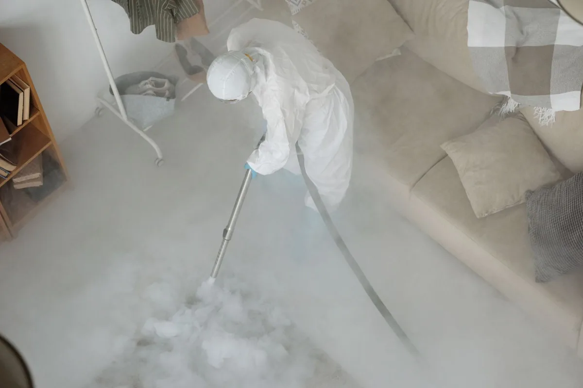 Biohazard cleanup technician in protective equipment, Chaska, MN